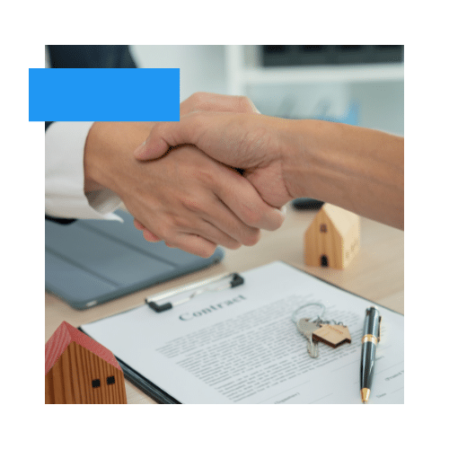 Real estate agent shaking hands with client, symbolizing trust and partnership in property management services.